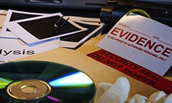 evidence sign, a compact disc, and some photos