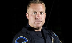 Police officer on black background